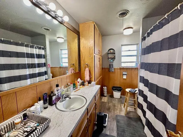 a kitchen with a sink appliances and cabinets