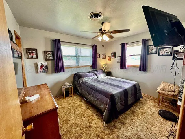 a view of a room with lots of gym equipment