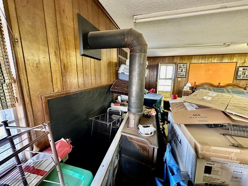 15200 Highway 152 Wheeler, TX 79096 - Photo 22 of 71 a bed room with furniture and a window