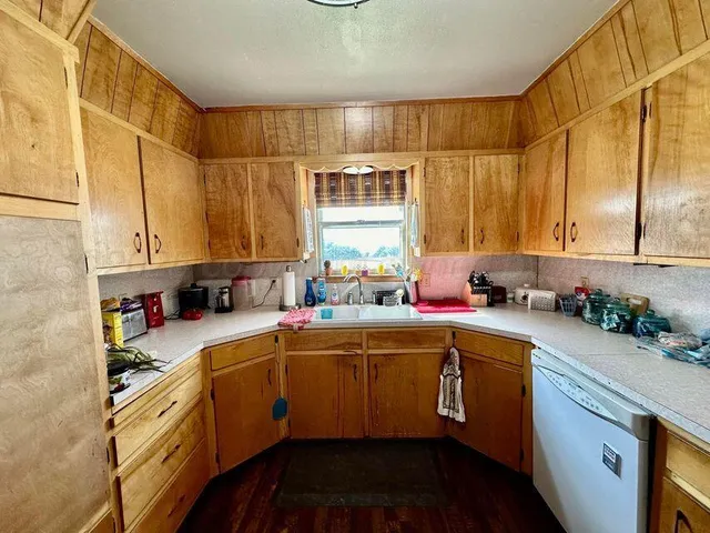 a bathroom with double vanity sinks a mirror and a shower