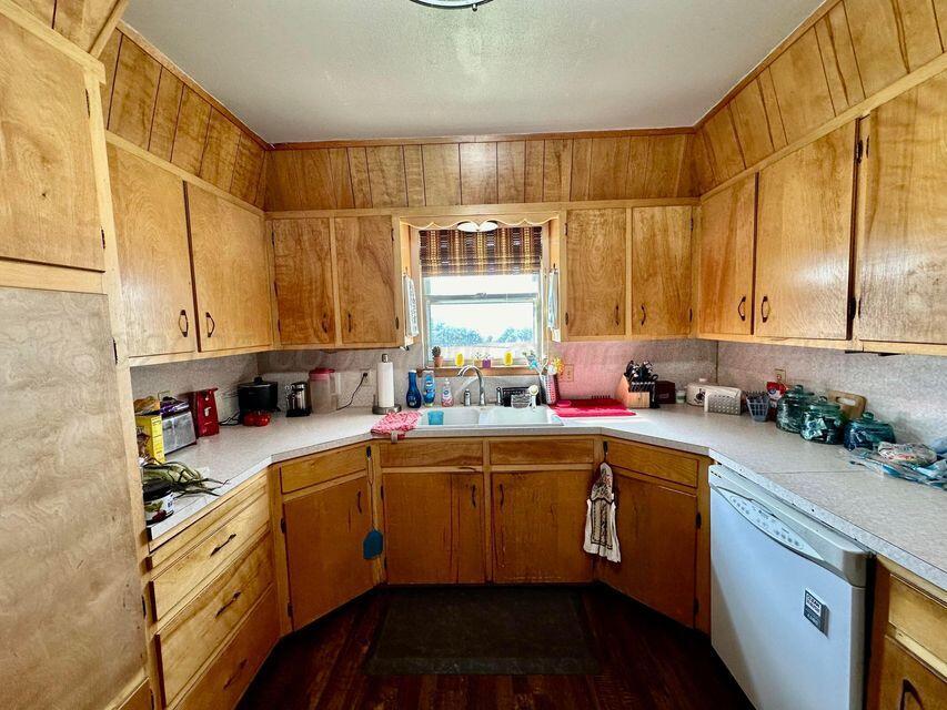15200 Highway 152 Wheeler, TX 79096 - Photo 10 of 71 a kitchen with a sink a window and cabinets