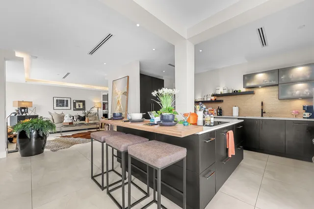 a kitchen with a sink and stove