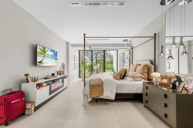 a bedroom with bed and window