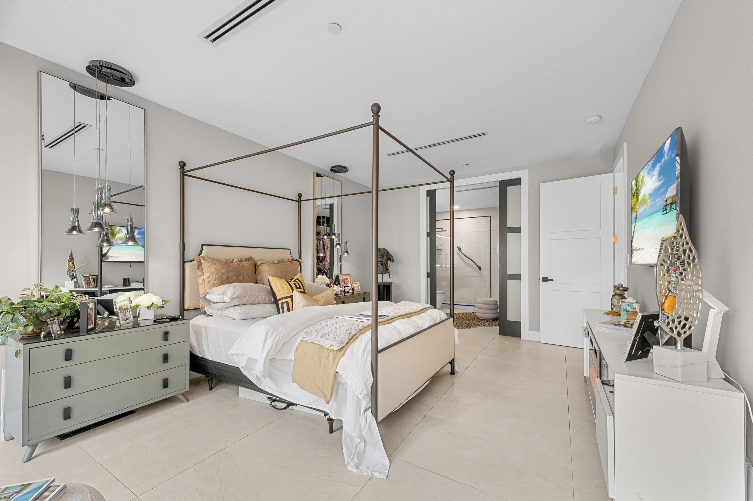 7819 Lakeside Boulevard, Unit 814 Boca Raton, FL 33434 - Photo 12 of 37 a bedroom with a bed mirror and window