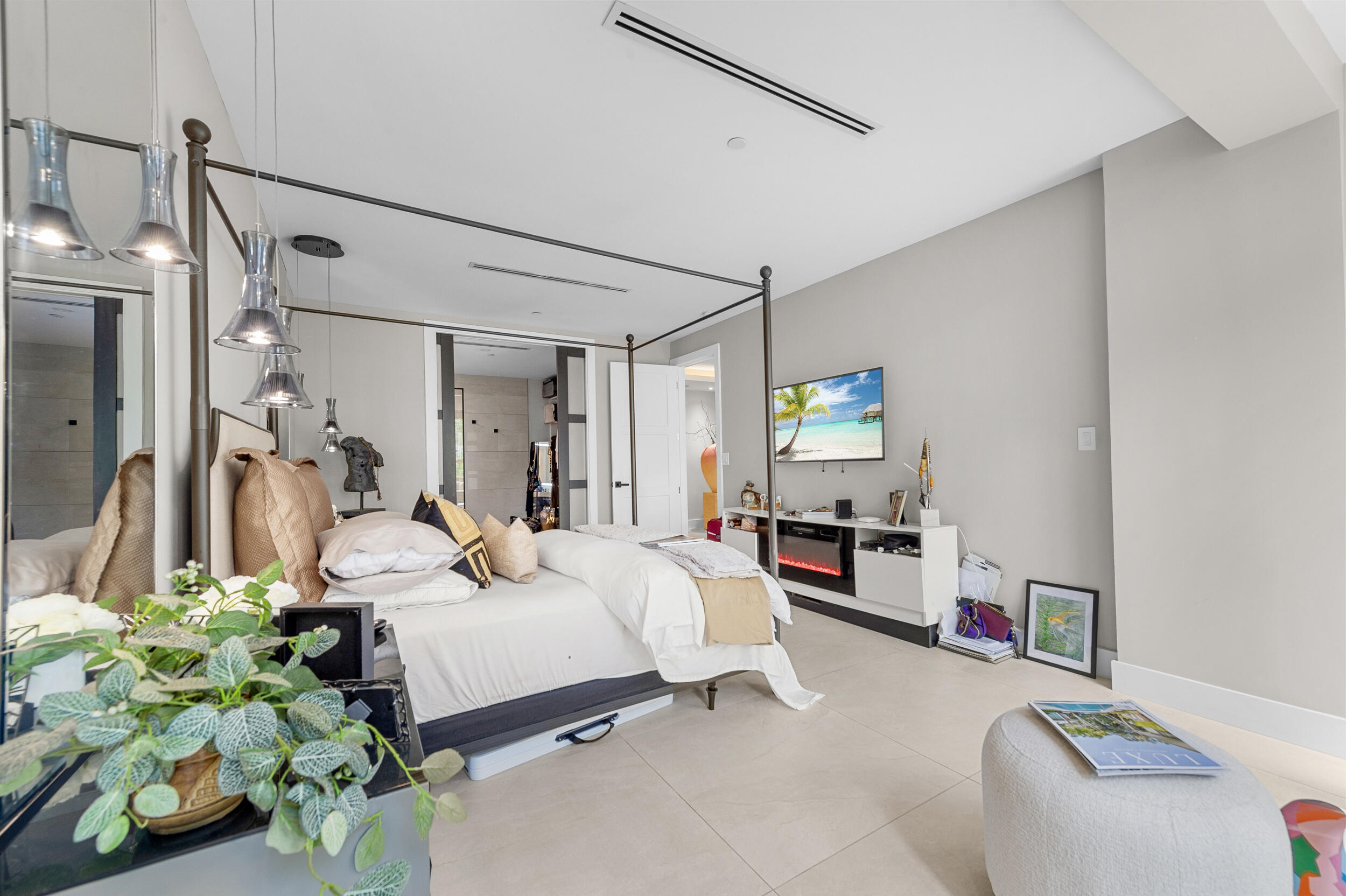 7819 Lakeside Boulevard, Unit 814 Boca Raton, FL 33434 - Photo 13 of 37 a bed room with a bed window and a couch