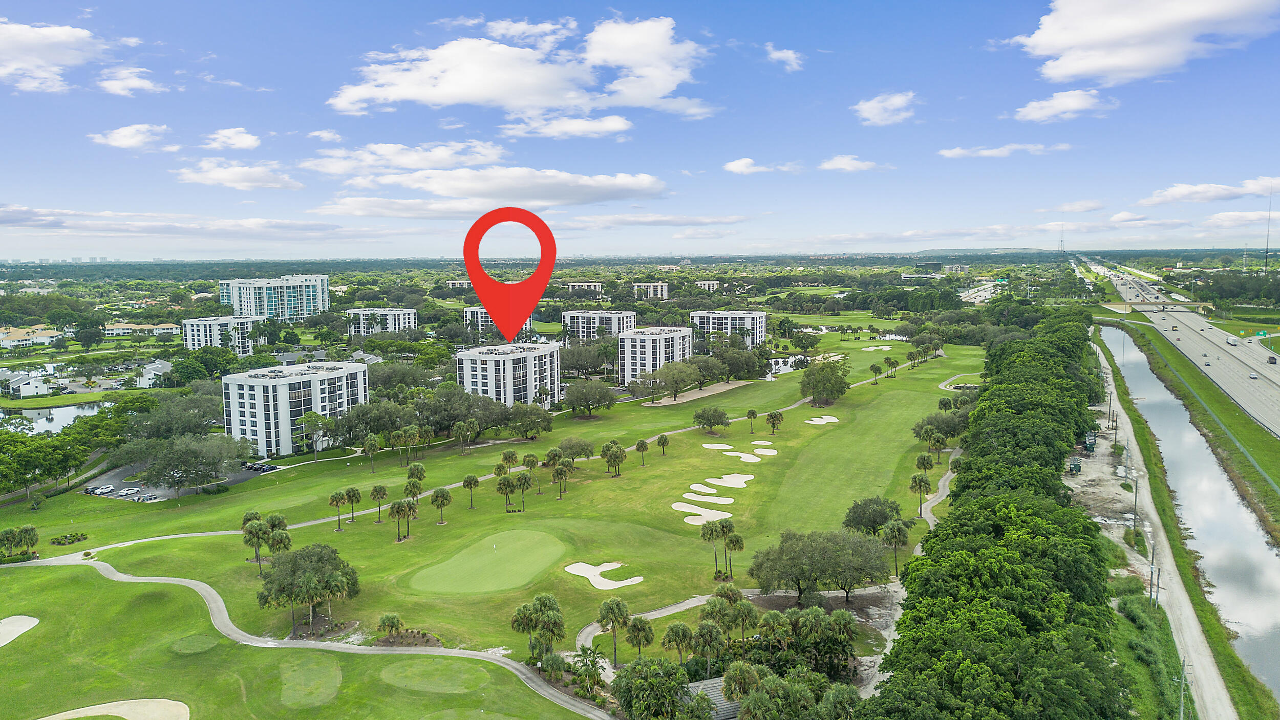7819 Lakeside Boulevard, Unit 814 Boca Raton, FL 33434 - Photo 29 of 37 a view of a swimming pool with a garden
