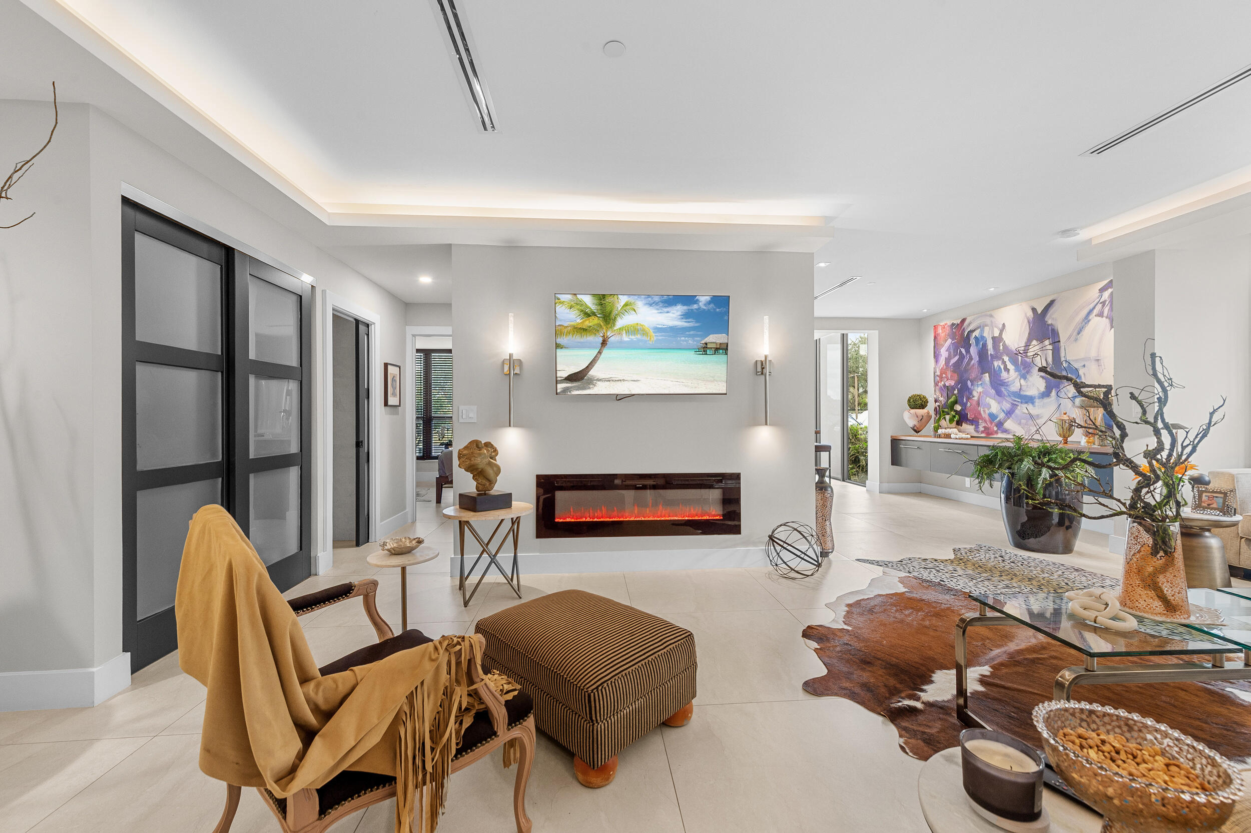 7819 Lakeside Boulevard, Unit 814 Boca Raton, FL 33434 - Photo 9 of 37 a living room with furniture and a flat screen tv