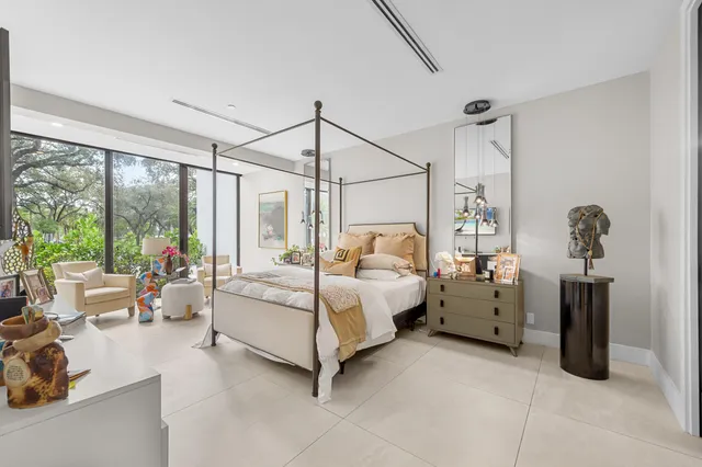 a bed room with a bed and a chandelier