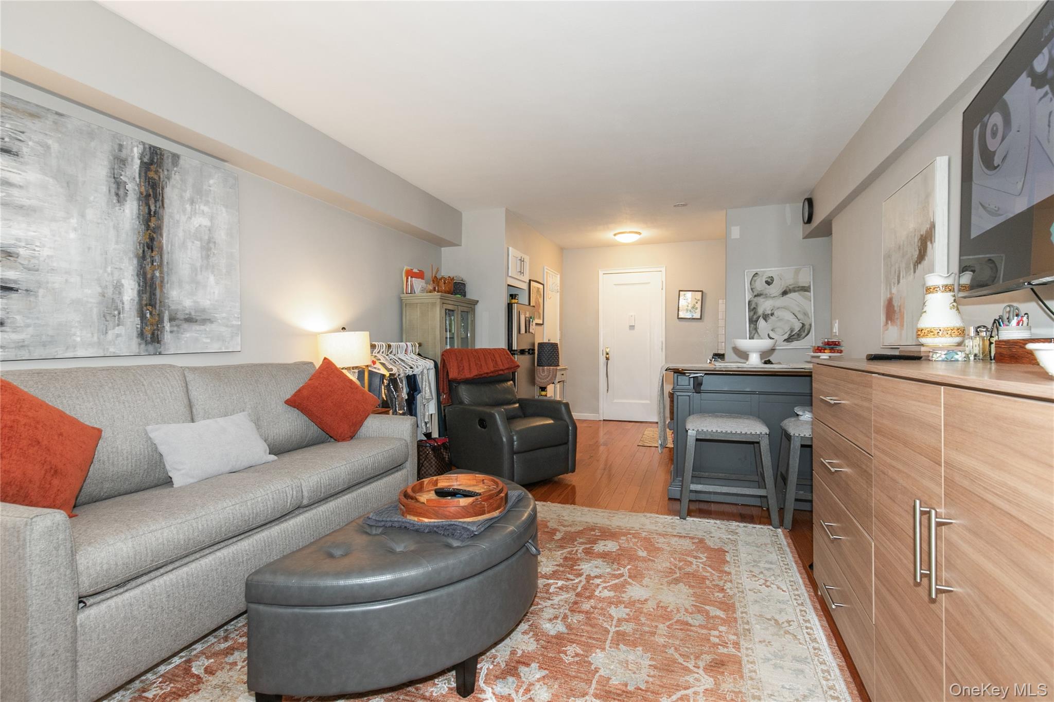 15 Canterbury Road, Unit D6 Great Neck, NY 11021 - Photo 9 of 21 a living room with furniture and a fireplace