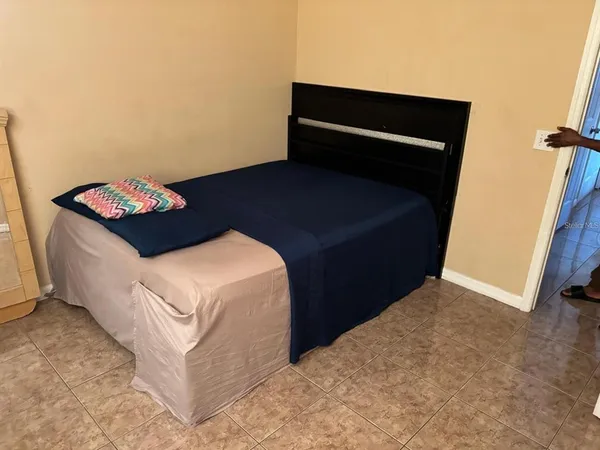 a bedroom with a bed and a cabinets