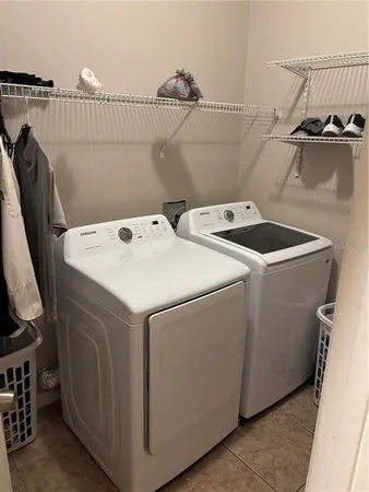 a utility room with dryer and washer