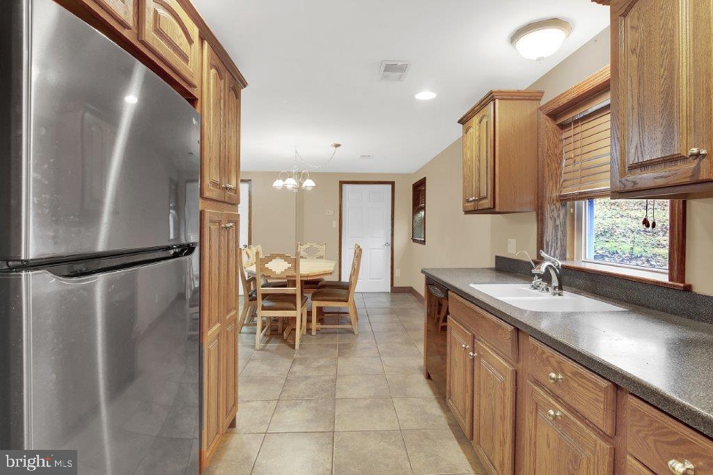 1159 Old Elk Neck Road Elkton, MD 21921 - Photo 11 of 32 Kitchen with Corian Counter Tops and Double Sink