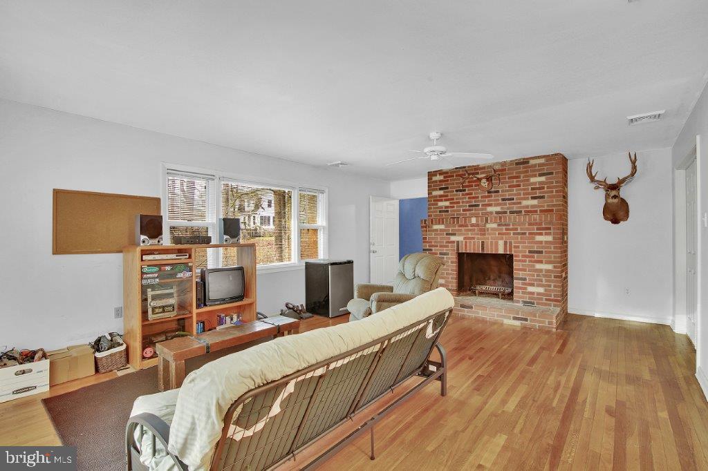1159 Old Elk Neck Road Elkton, MD 21921 - Photo 25 of 32 Living Room with Bricked Wood Burning Fireplace