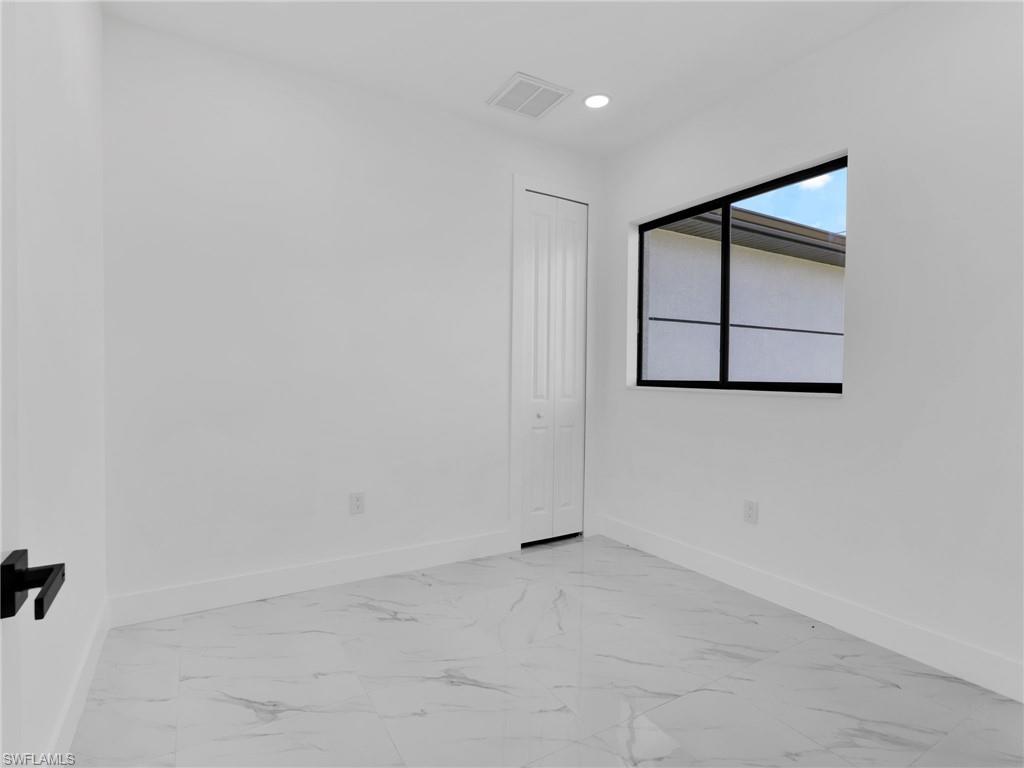 3417 8th Street Southwest Lehigh Acres, FL 33976 - Photo 23 of 32 a view of an empty room
