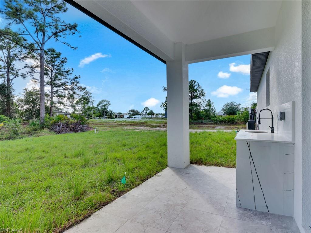 3417 8th Street Southwest Lehigh Acres, FL 33976 - Photo 26 of 32 a view of a house and garden
