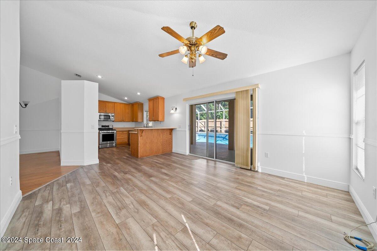 432 Stonehenge Circle Rockledge, FL 32955 - Photo 16 of 41 a view of a livingroom with a ceiling fan and window