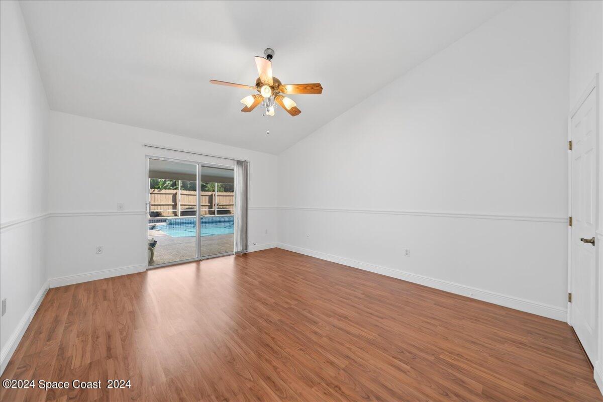 432 Stonehenge Circle Rockledge, FL 32955 - Photo 20 of 41 wooden floor in an empty room with a window
