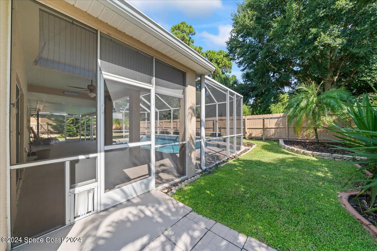 432 Stonehenge Circle Rockledge, FL 32955 - Photo 30 of 41 a view of a house with backyard and wooden fence