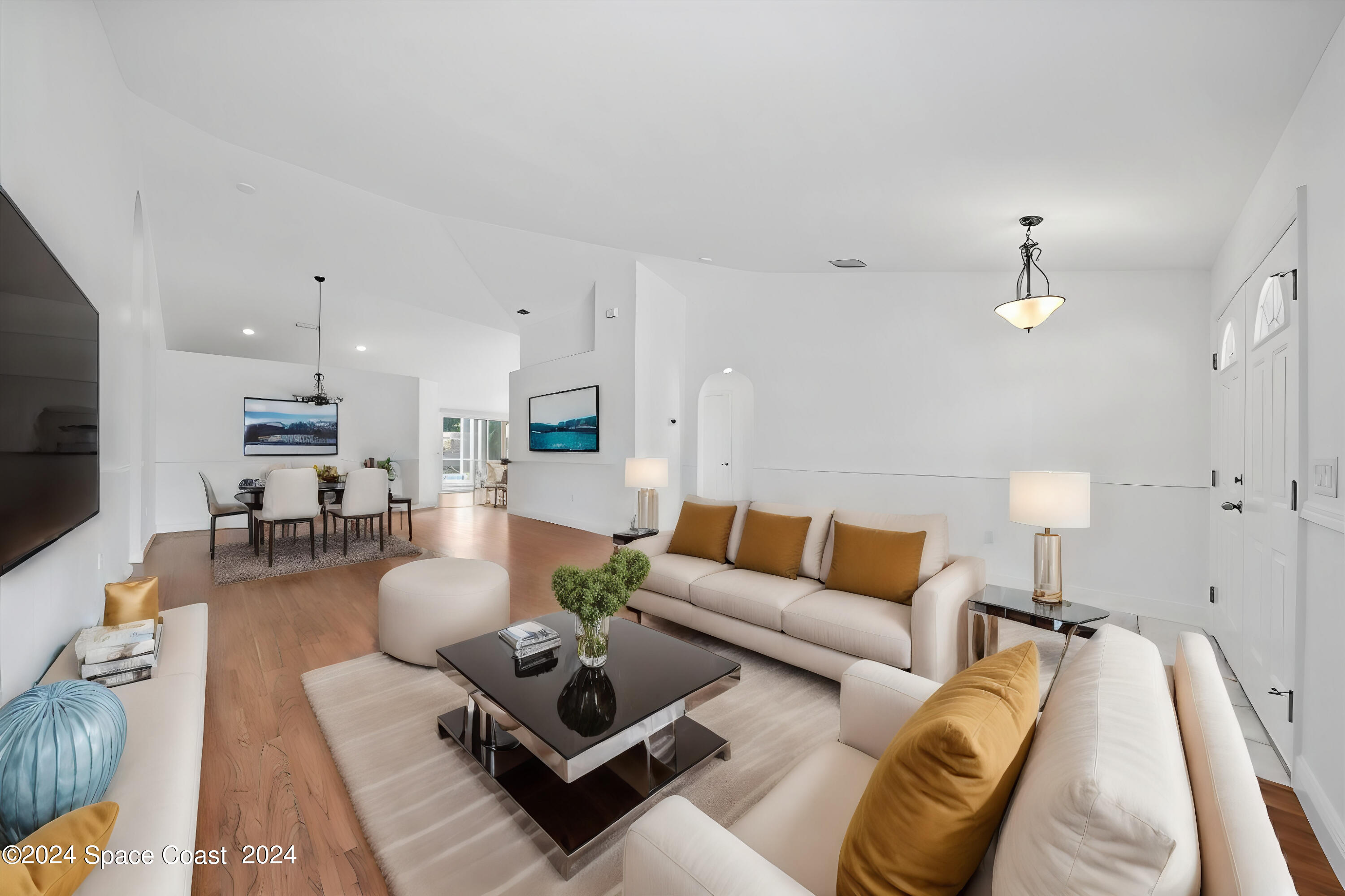 432 Stonehenge Circle Rockledge, FL 32955 - Photo 4 of 41 a living room with furniture and a flat screen tv