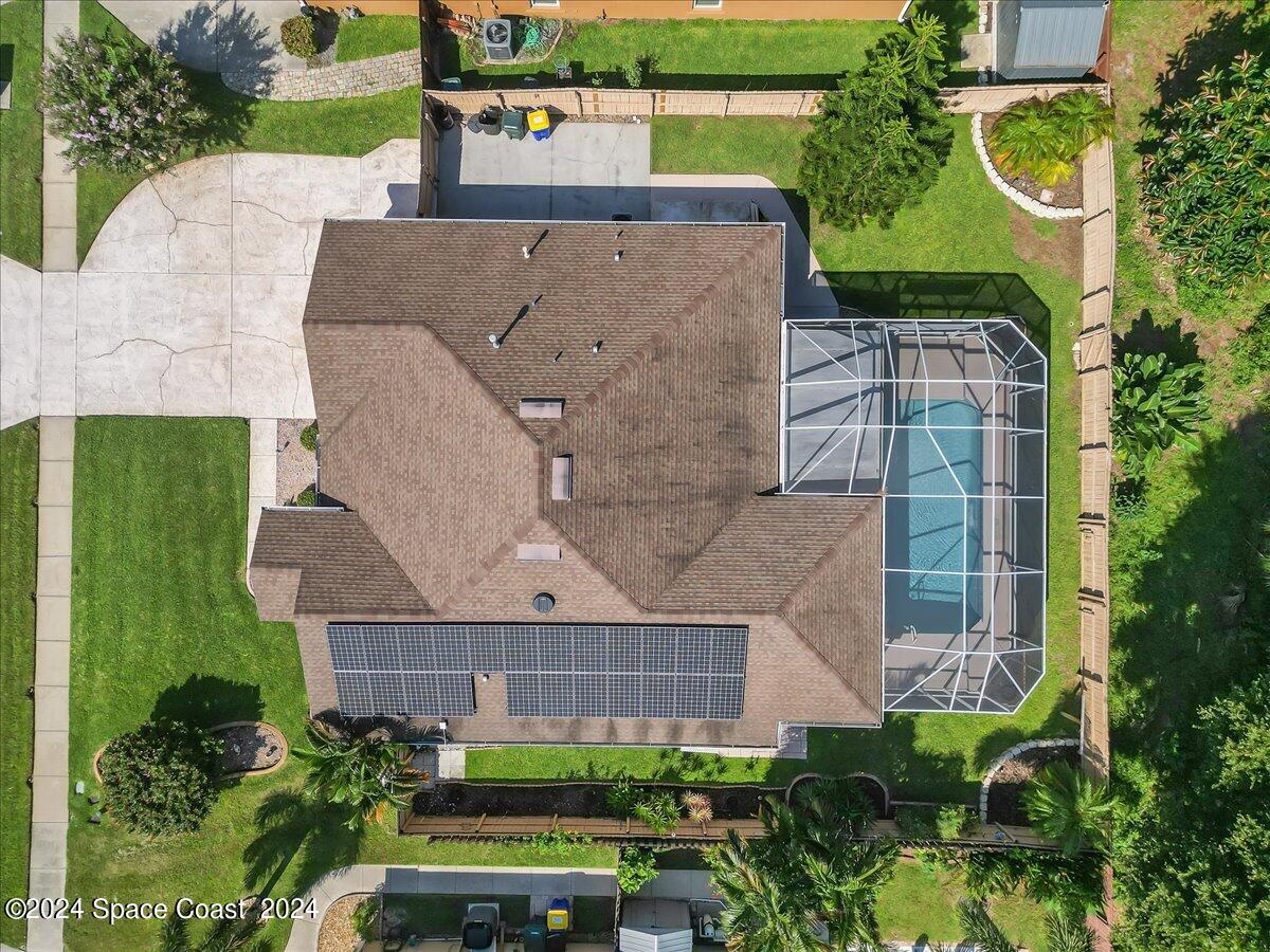 432 Stonehenge Circle Rockledge, FL 32955 - Photo 41 of 41 an aerial view of a house with a garden and plants