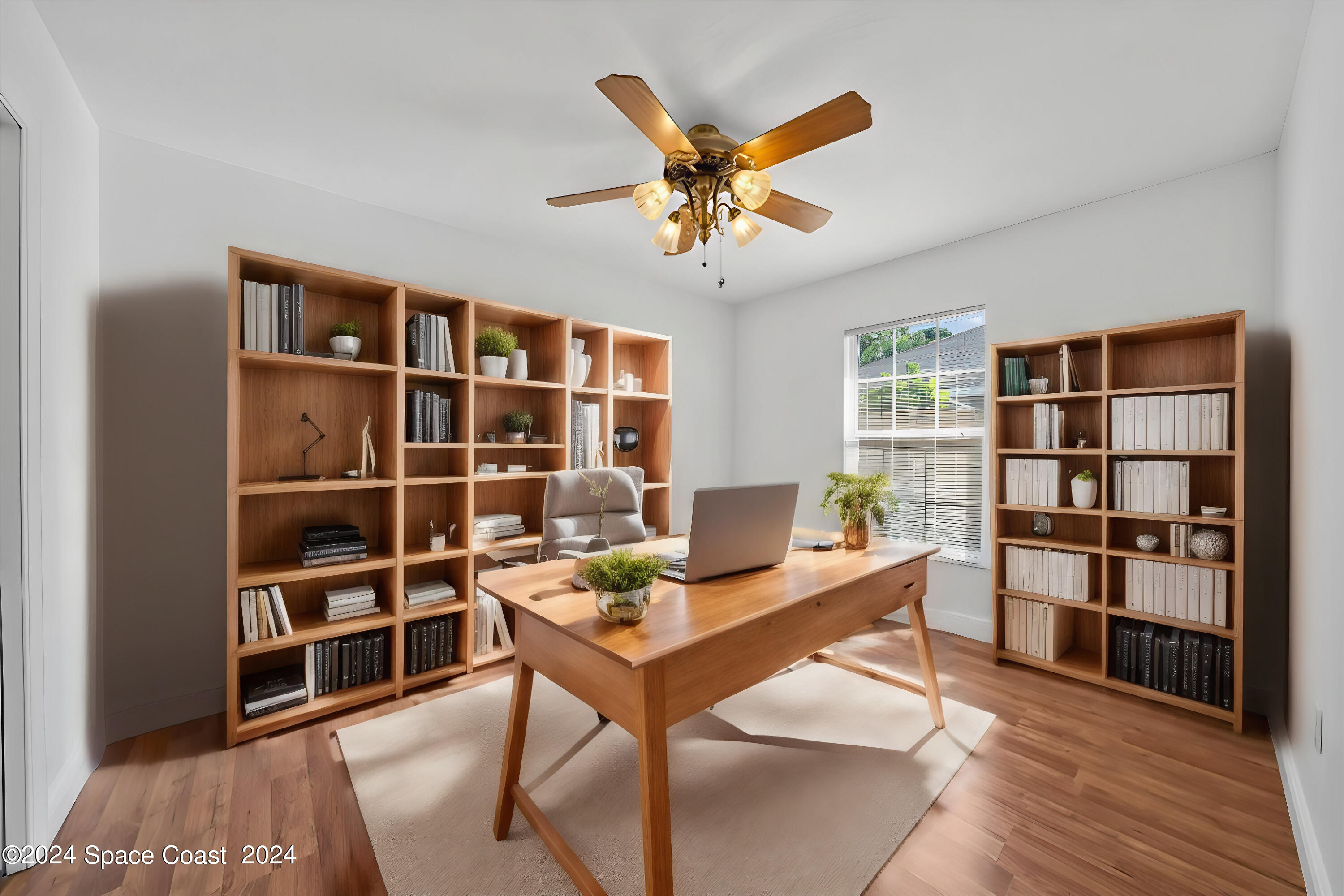 432 Stonehenge Circle Rockledge, FL 32955 - Photo 8 of 41 a workspace with a bookshelf