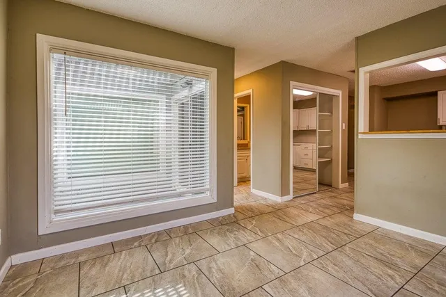 a view of a bedroom with a window