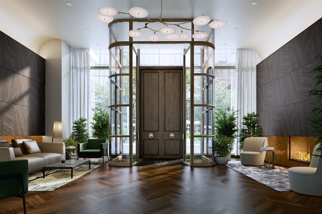 40 Trinity Place, Unit 1605 Boston, MA 02116 - Photo 15 of 16 a living room with furniture and wooden floor