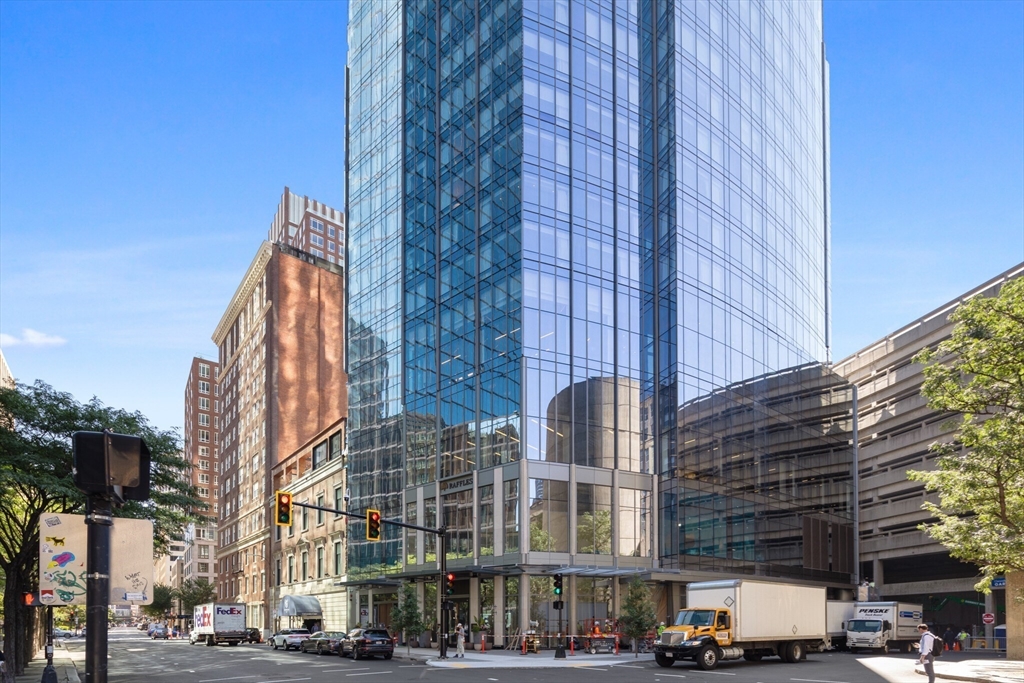 40 Trinity Place, Unit 1605 Boston, MA 02116 - Photo 10 of 16 a city street lined with tall buildings