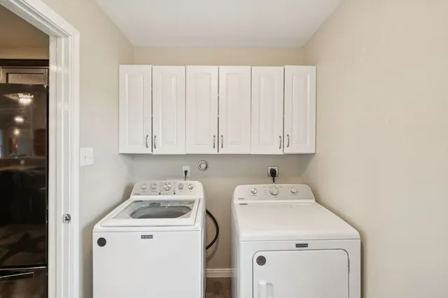 a utility room with dryer and washer
