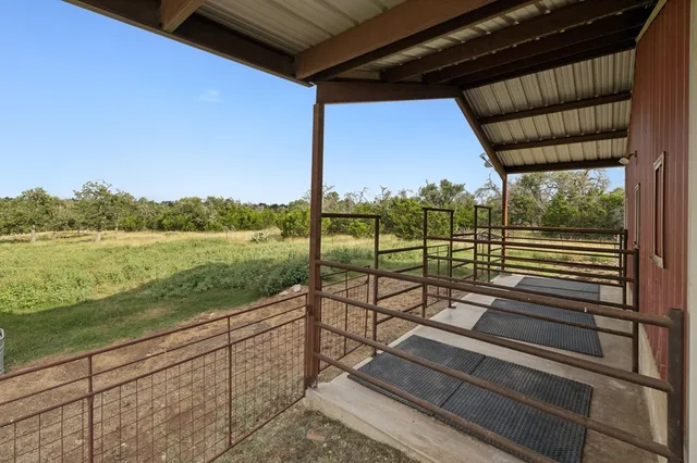 a view of a floor to ceiling window and lake view