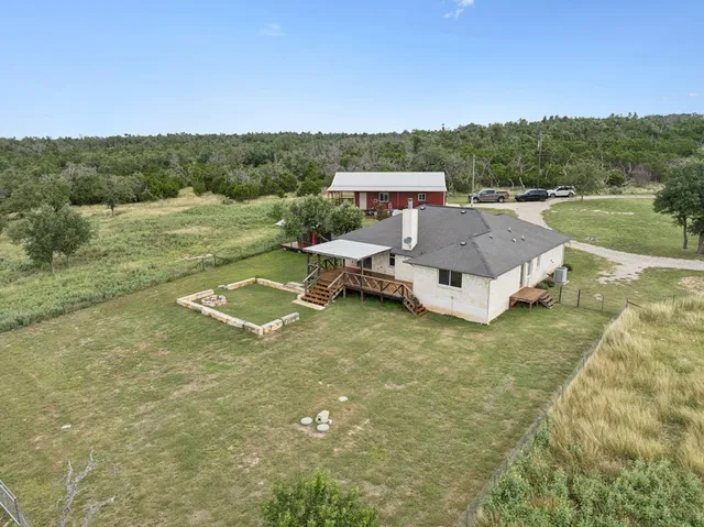 a aerial view of a house with a yard