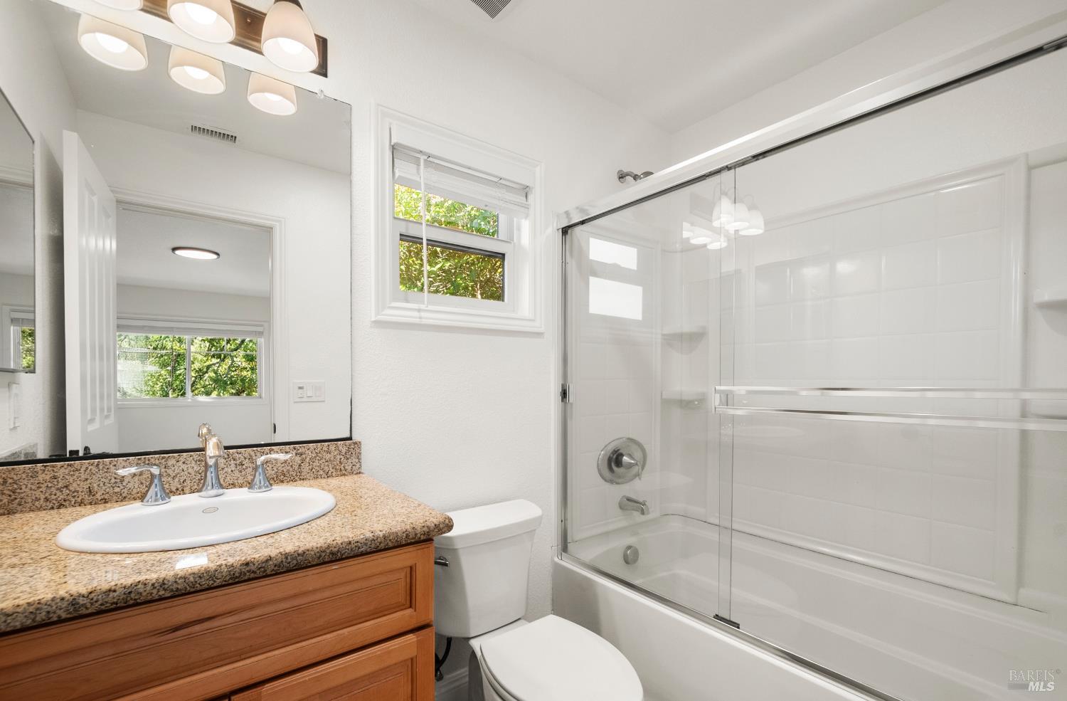 256 Rosebud Lane St. Helena, CA 94574 - Photo 20 of 33 a bathroom with a granite countertop sink toilet and shower