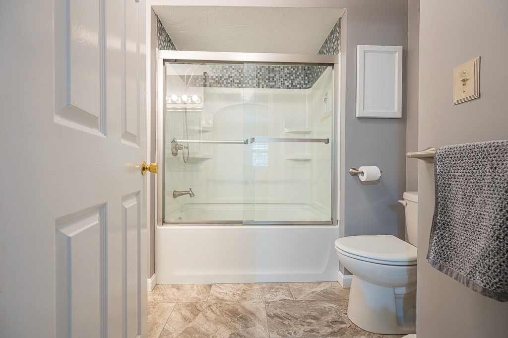 4 Tuck Farm Road, Unit 6 Auburn, MA 01501 - Photo 15 of 20 a bathroom with a toilet and a shower