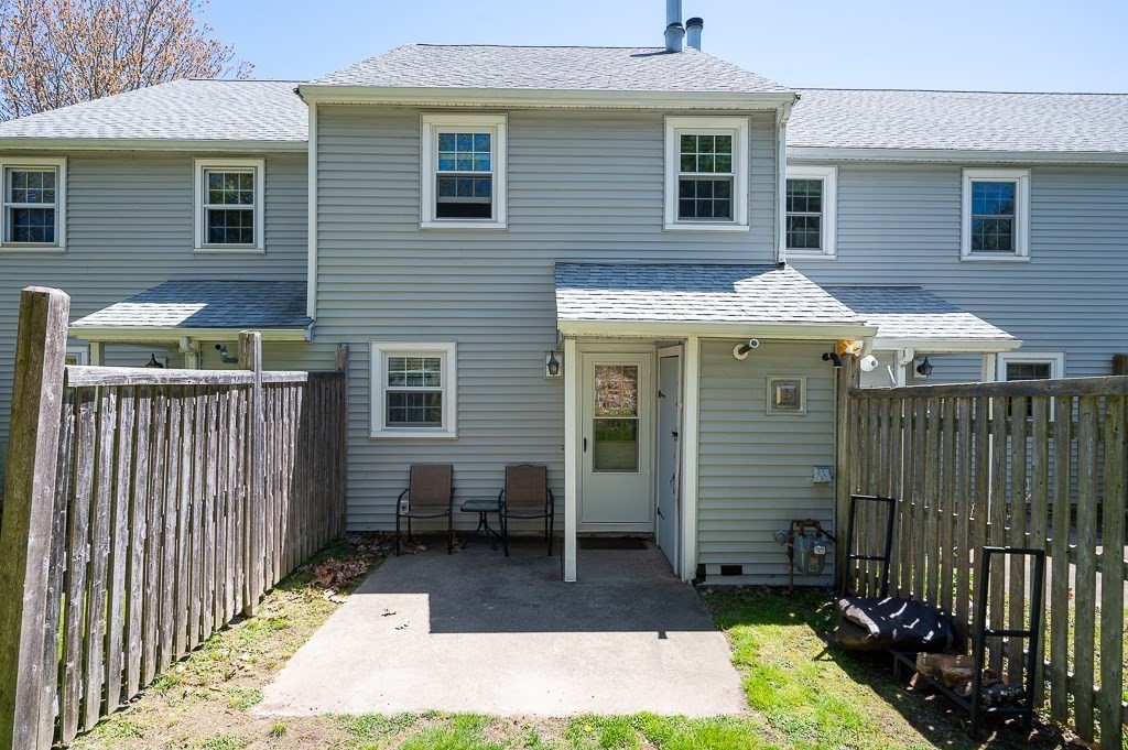4 Tuck Farm Road, Unit 6 Auburn, MA 01501 - Photo 20 of 20 a view of a house with a yard and sitting area