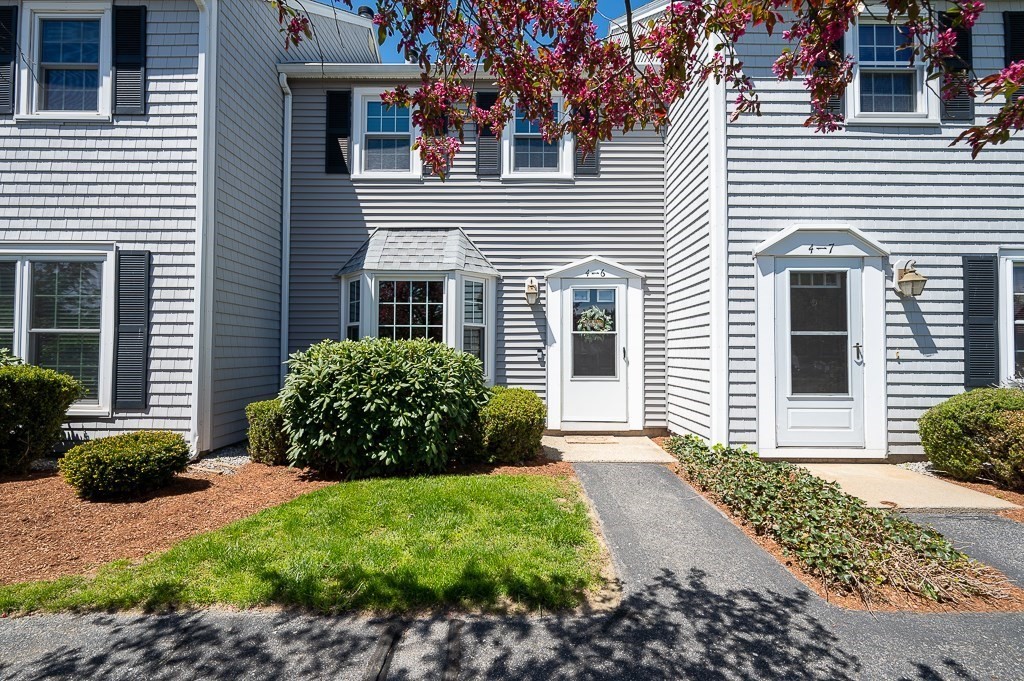 4 Tuck Farm Road, Unit 6 Auburn, MA 01501 - Photo 2 of 20 a view of a house with a garden