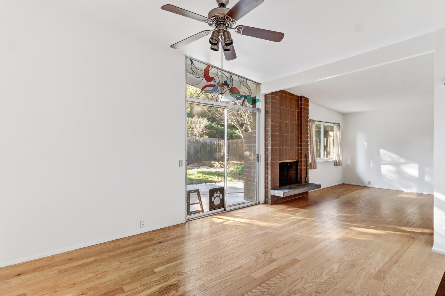 3216 Trawler Place Davis, CA 95616 - Photo 8 of 38 a view of an empty room with a fireplace and a window