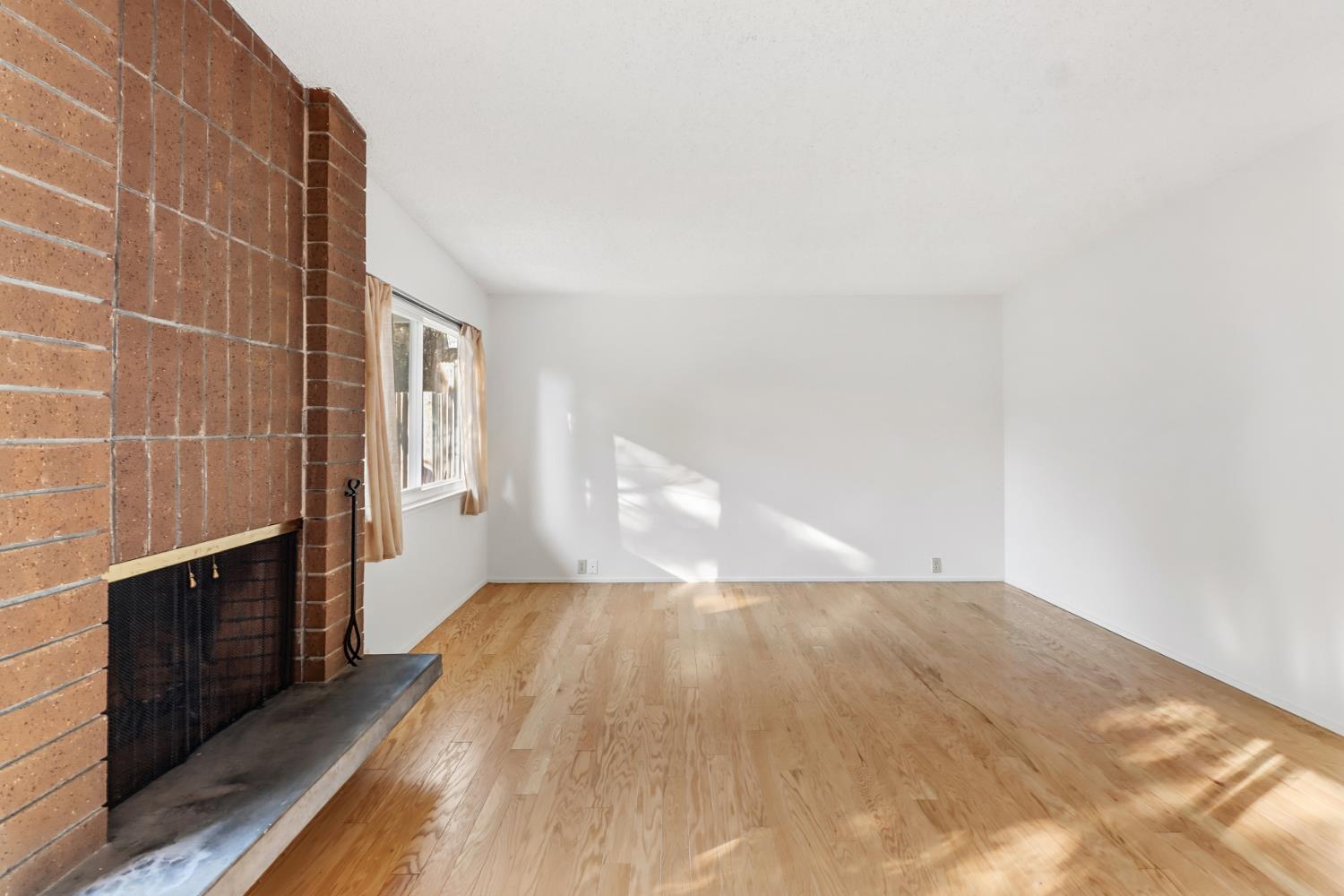 3216 Trawler Place Davis, CA 95616 - Photo 9 of 38 a view of empty room with wooden floor and fan