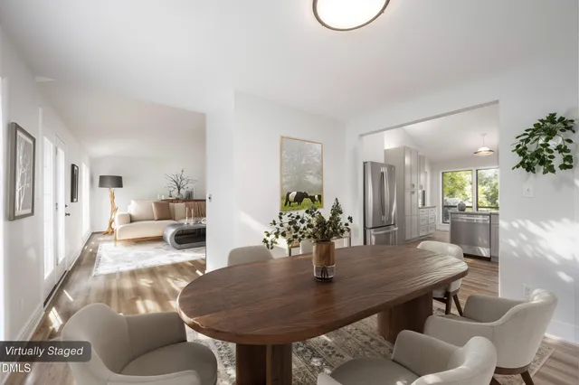 a bedroom with furniture and a large window