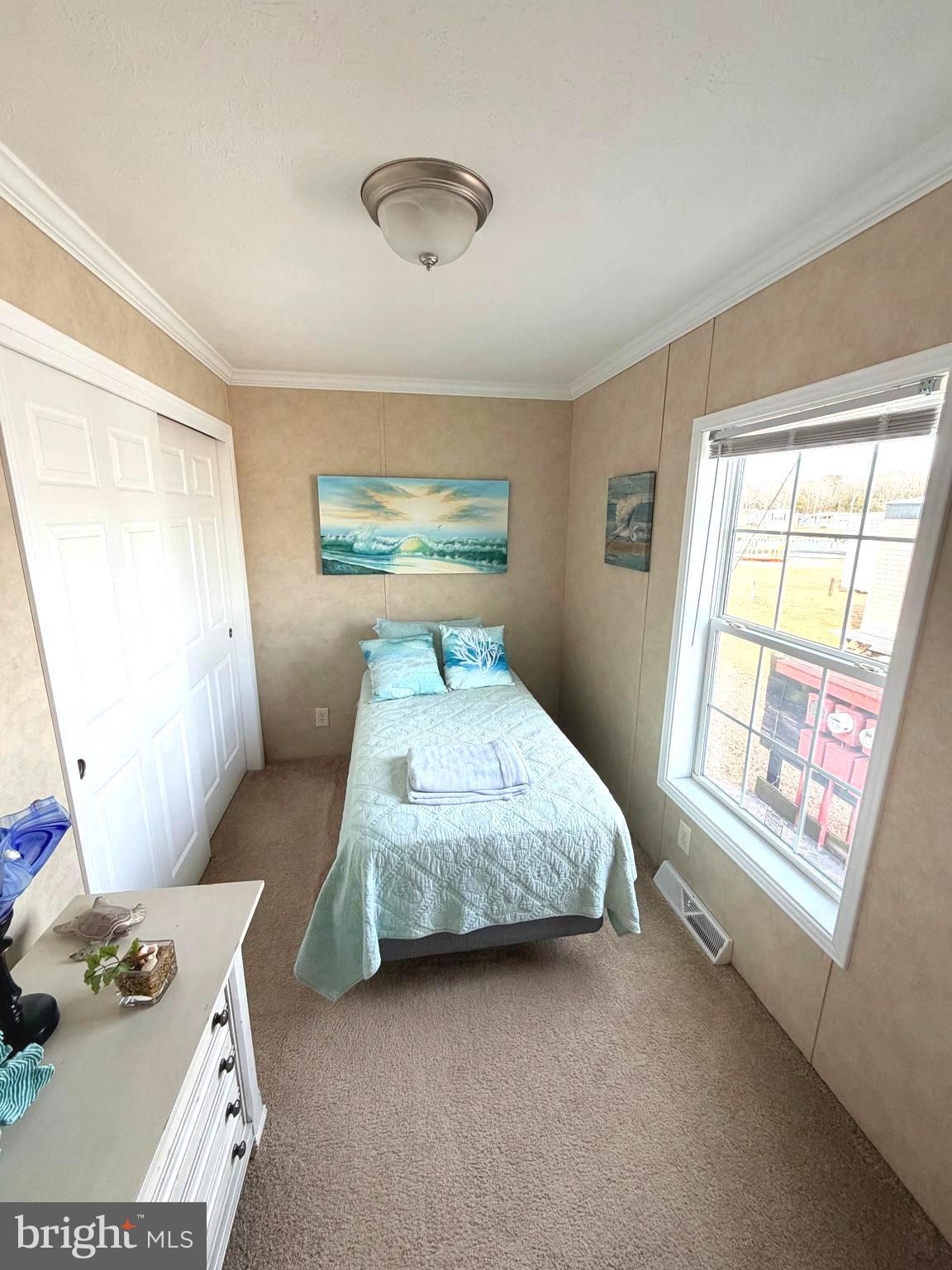 38025 Rabbit Road, Unit 101 Ocean View, DE 19970 - Photo 60 of 112 a bedroom with a bed and wooden floor