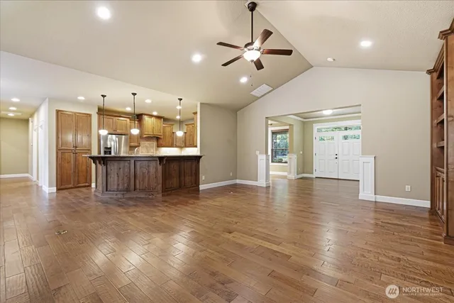 a view of a kitchen with a sink and a refrigerator