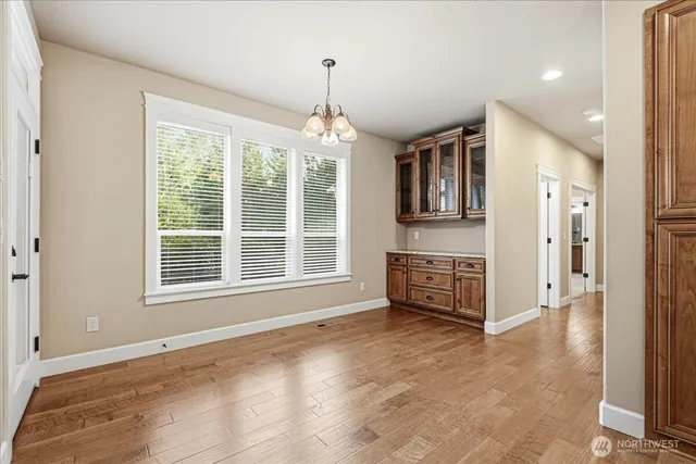 a view of livingroom with hardwood floor and a ceiling fan