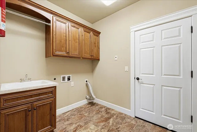 a kitchen with a sink and cabinets