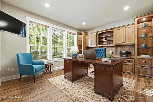 a kitchen with a stove a sink and a microwave