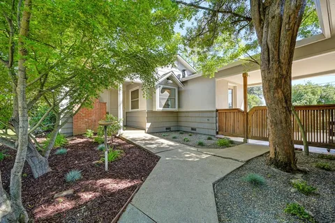 a front view of a house with garden