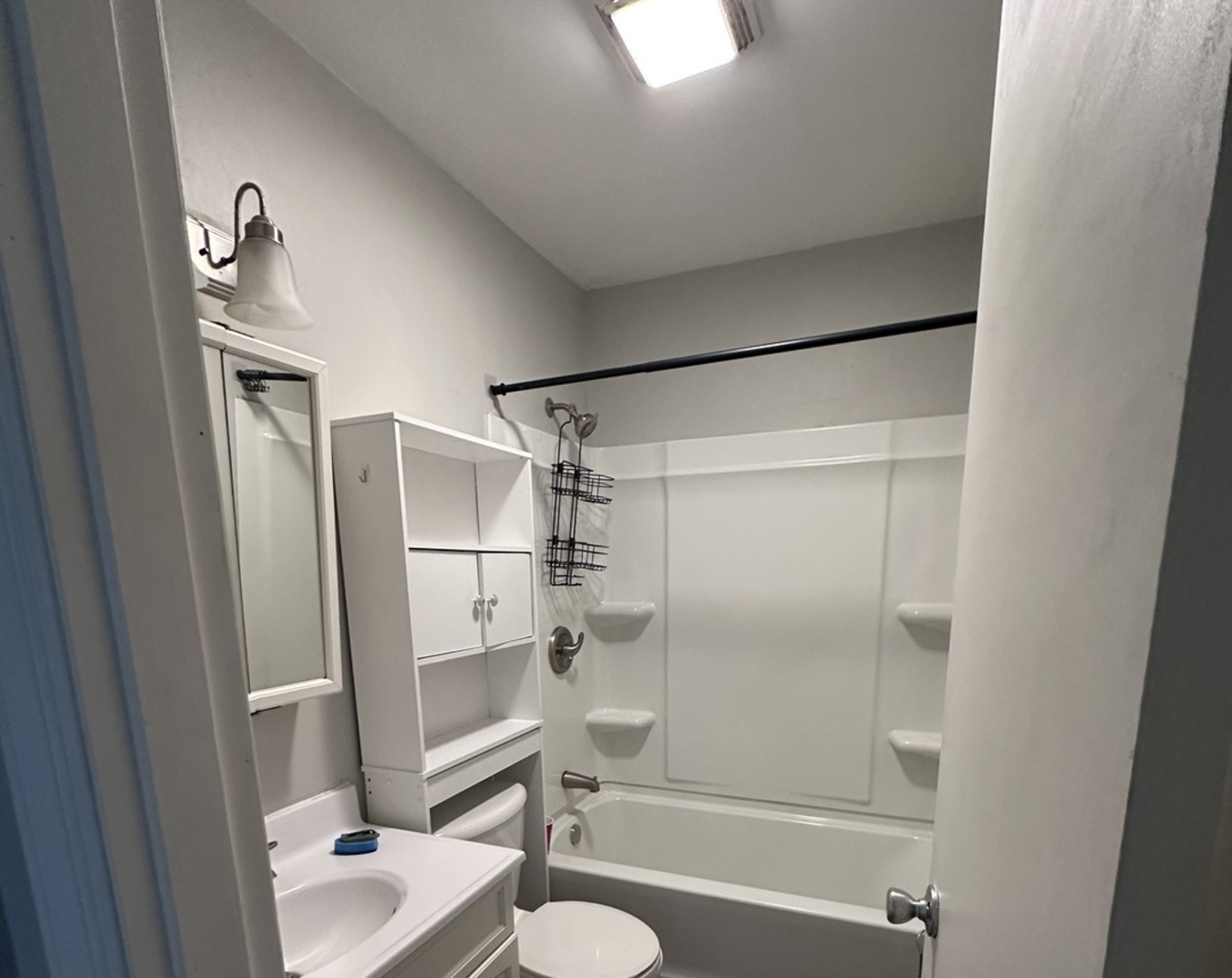 100 West 3rd Street Sublette, IL 61367 - Photo 13 of 18 a bathroom with a shower a toilet and a sink