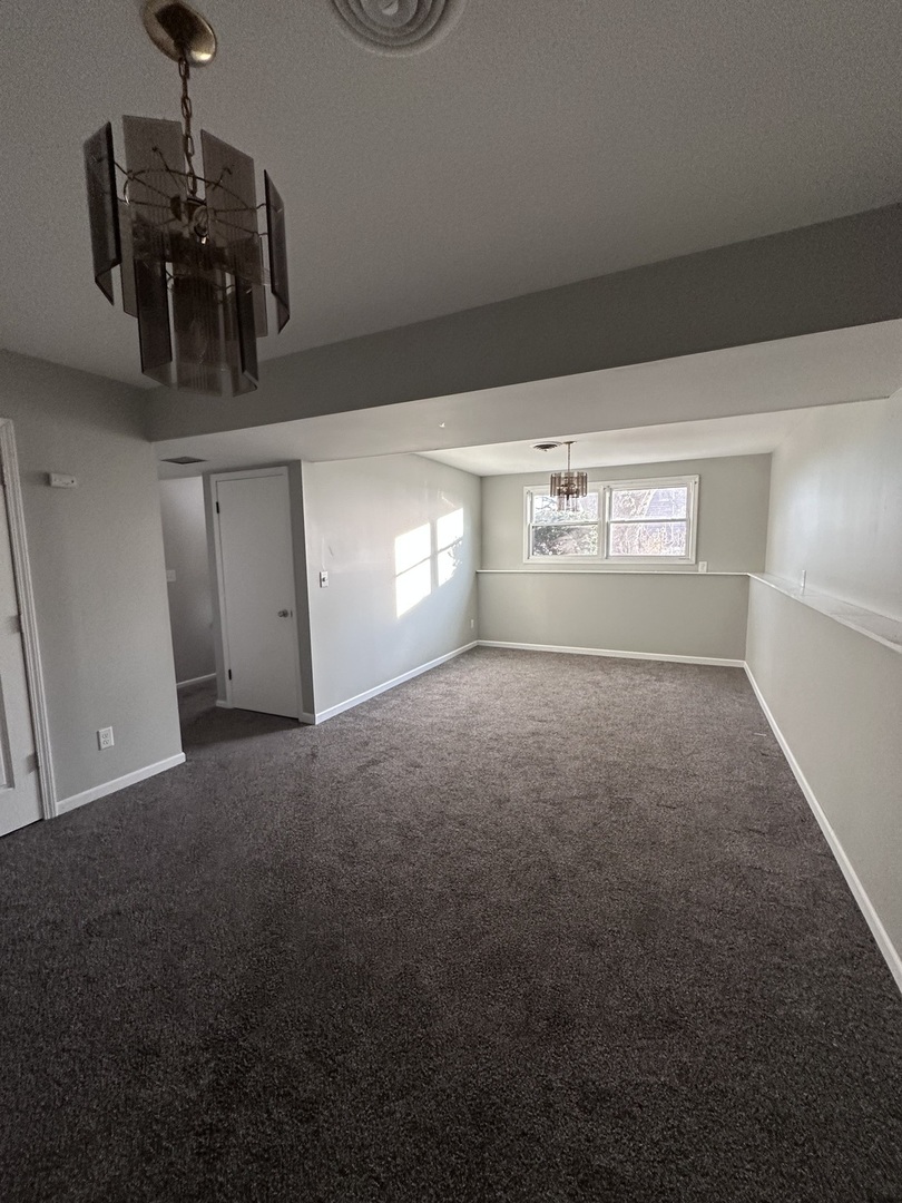 100 West 3rd Street Sublette, IL 61367 - Photo 5 of 18 a view of empty room with windows