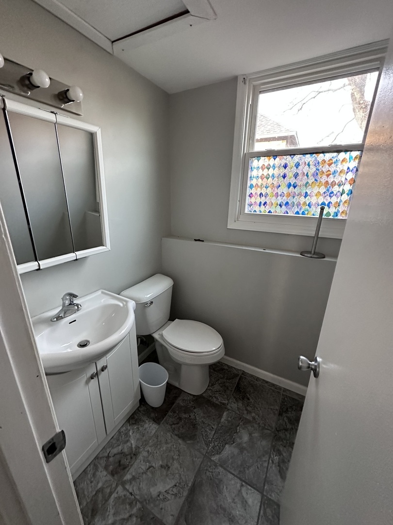 100 West 3rd Street Sublette, IL 61367 - Photo 8 of 18 a bathroom with a toilet sink and mirror