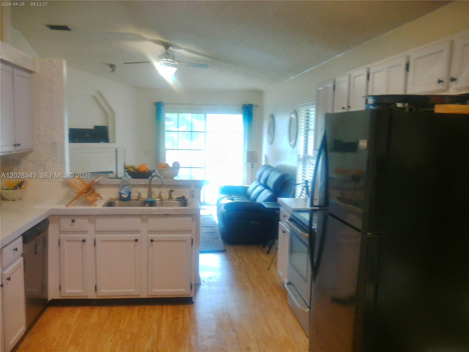 1641 Spring Oaks Lane Jacksonville, FL 32221 - Photo 22 of 44 a kitchen with a refrigerator and a sink
