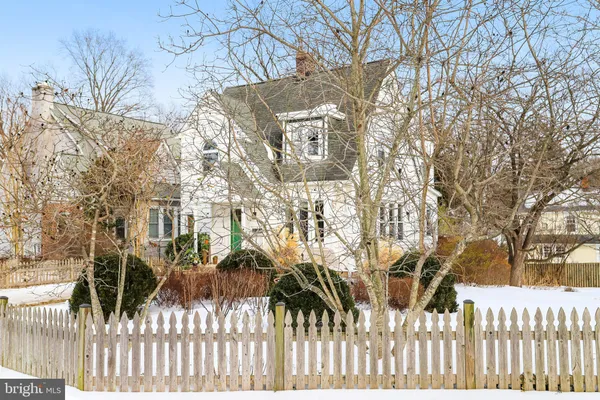 a view of a white house with a snow