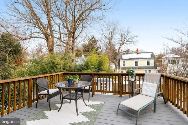 a view of a deck with a table and chairs